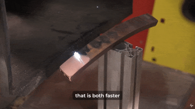 Industrial metal laser cleaning process with a laser, showcasing advanced equipment used in radwaste management and industrial applications.